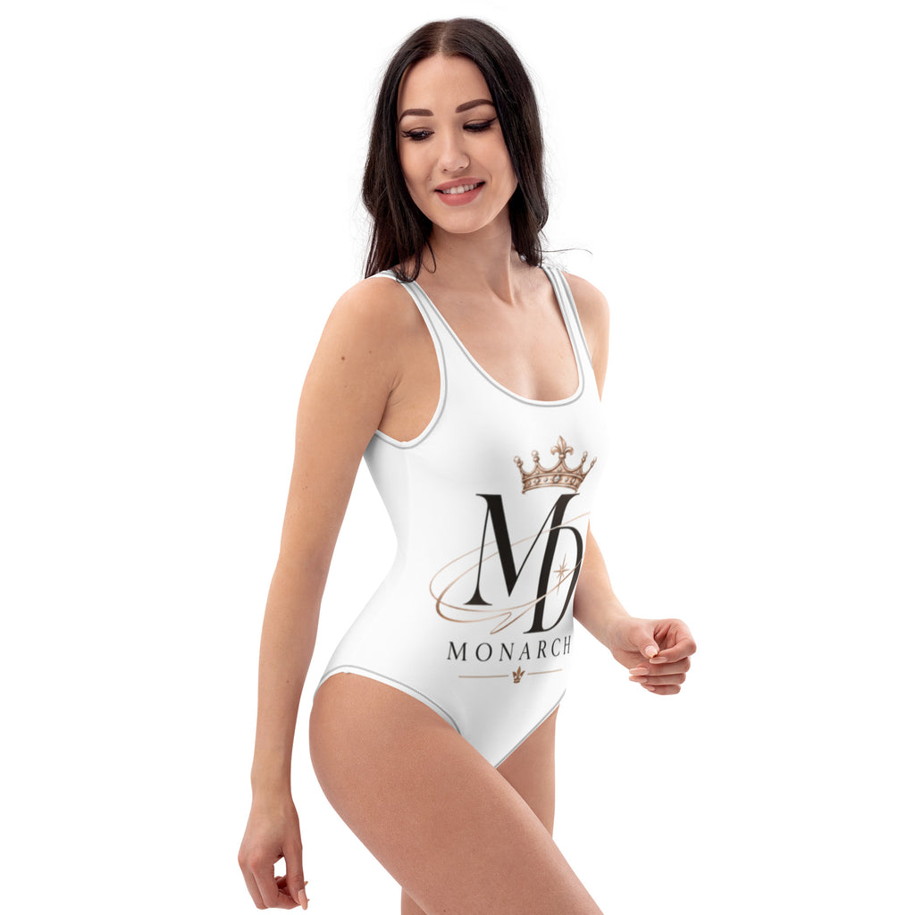 Women's MD-Monarch one-piece swimsuit in white with monogram and crown print, side view on model