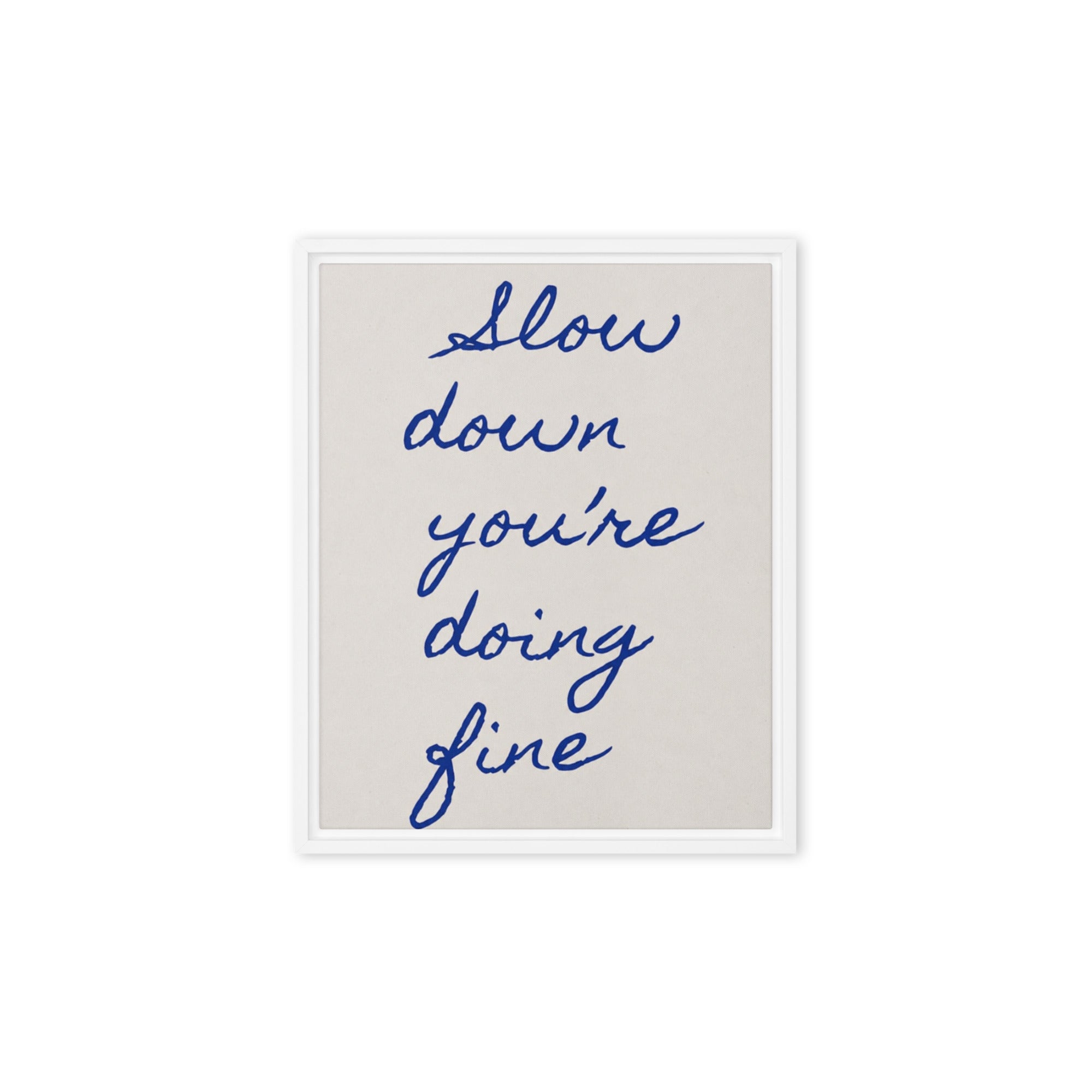 Framed canvas with handwritten navy blue quote "Slow down you're doing fine" on beige background, white pine wood floating frame / Картина с рамка с ръкописен цитат „Забави се, справяш се добре" в тъмносиньо на бежов фон, бяла плаваща рамка