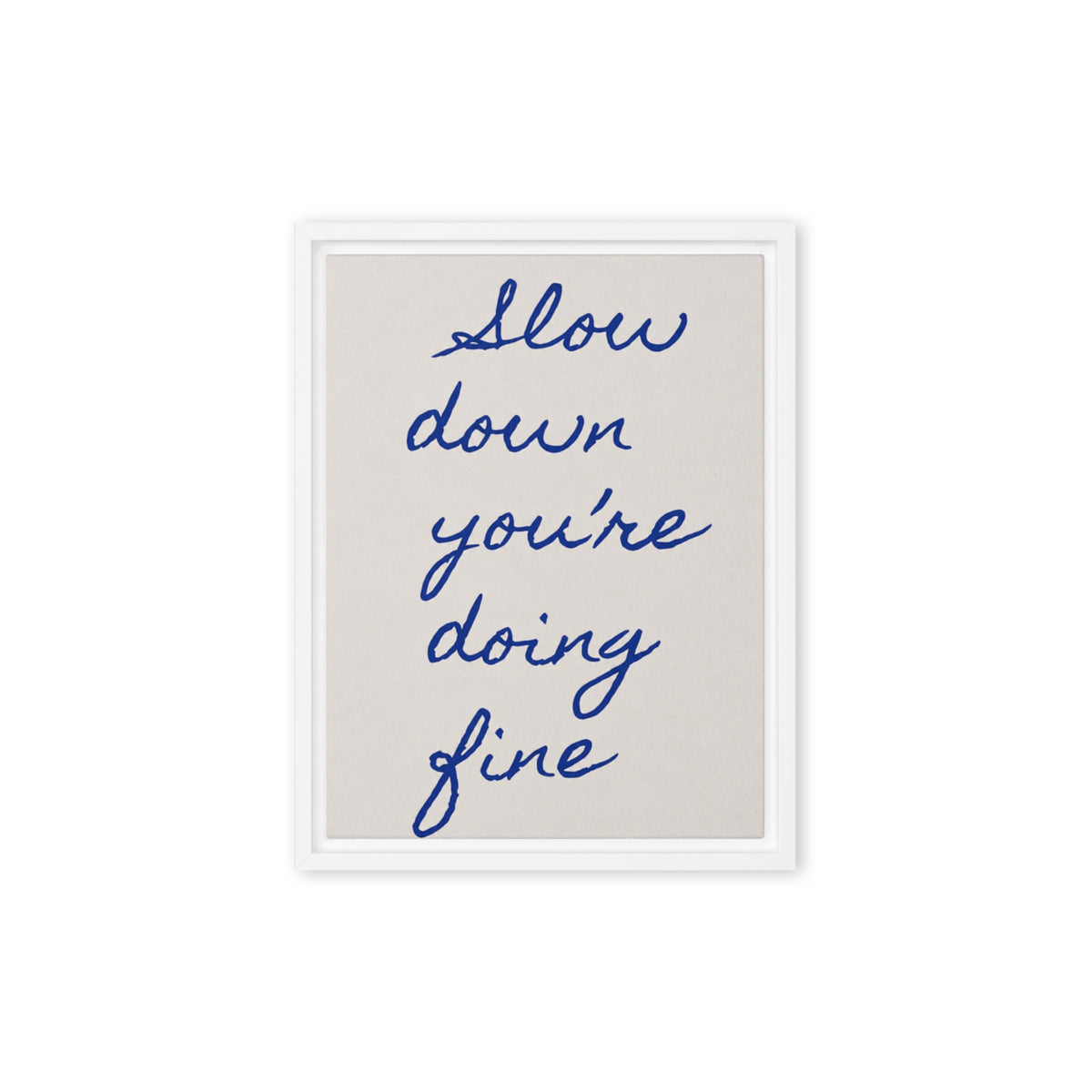 White framed canvas wall art with navy blue cursive quote "Slow down you're doing fine" on neutral beige background / Бяла рамка канава с мотивационен надпис „Забави се, справяш се добре" в тъмносиньо