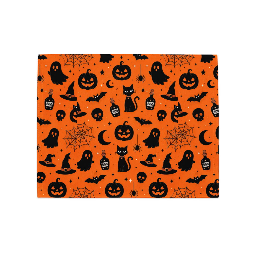 Halloween placemat with ghosts, black cats, bats and witch hats on orange background – festive table decor / Хелоуин подложка за маса с призраци, черни котки, прилепи и вещерски шапки на оранжев фон