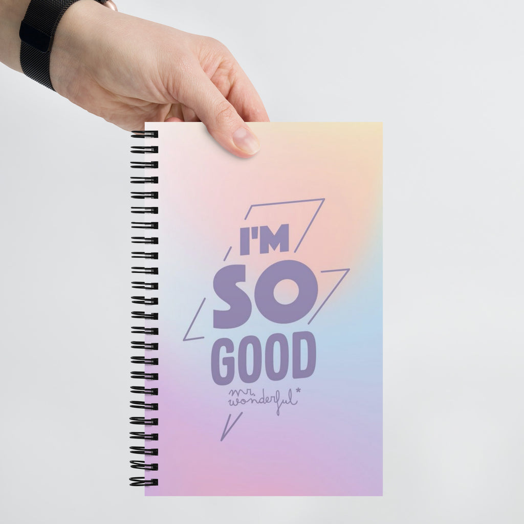 Close-up of dotted pages inside spiral notebook – 140 cream dot grid pages ideal for bullet journaling, sketching and note-taking
