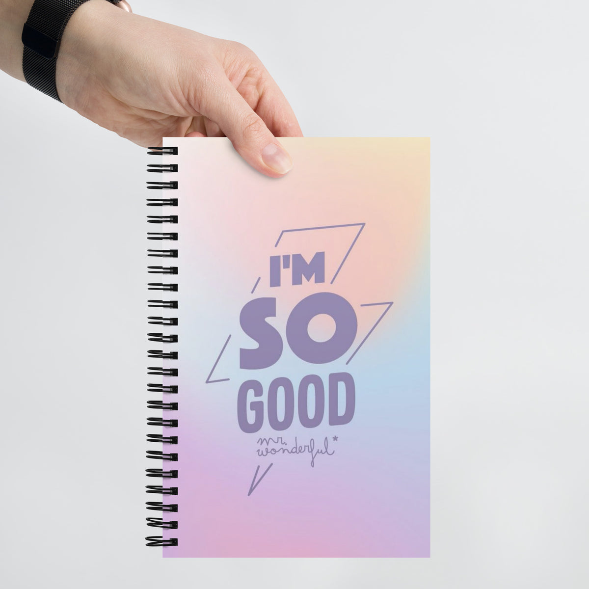 Close-up of dotted pages inside spiral notebook – 140 cream dot grid pages ideal for bullet journaling, sketching and note-taking
