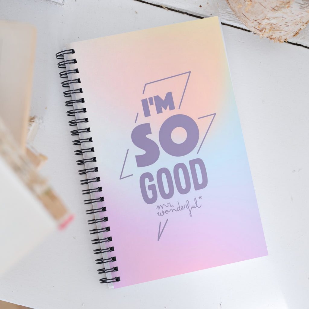 Spiral notebook open flat showing 180-degree lay-flat design with dotted grid pages – perfect everyday notebook for students and creatives
